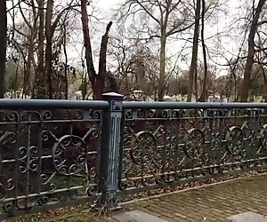 Cumming in a cemetery