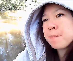 My cute asian girlfriend sucking me off in a public park and swallowing