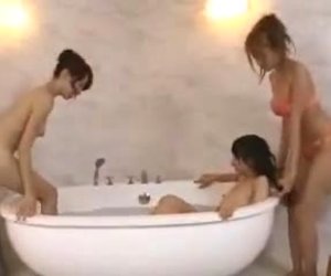 Asian Lesbians having fun squirting and massaging