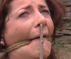 Crucified red haired slut is asking for help