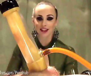 Latex Dominatrix Milks Slave Boy