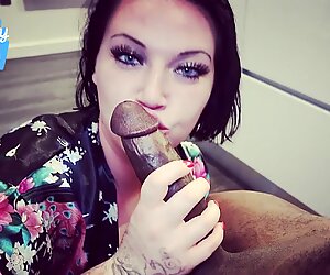 SUCKING A BIG BLACK COCK WITH TWO HANDS