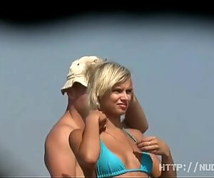 Exibitionist girl getting naked on the beach
